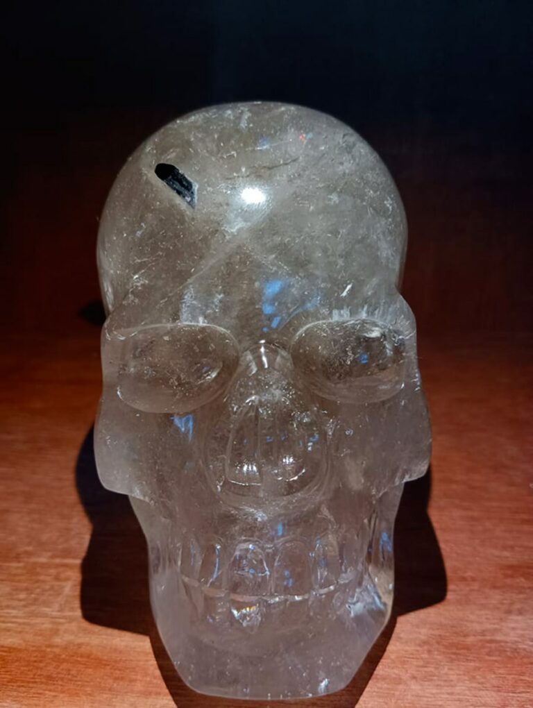 Rock crystal skull with black tourmaline inclusion